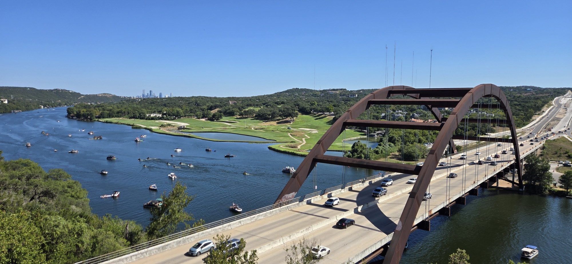 The Pennybacker Bridge over Lake Austin winding through the Hill Country